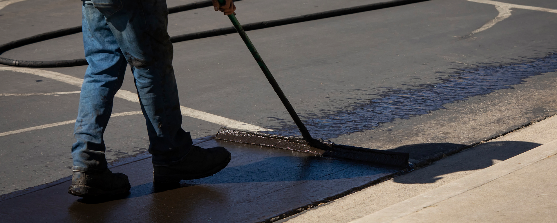 Sealcoating driveway with squeegee